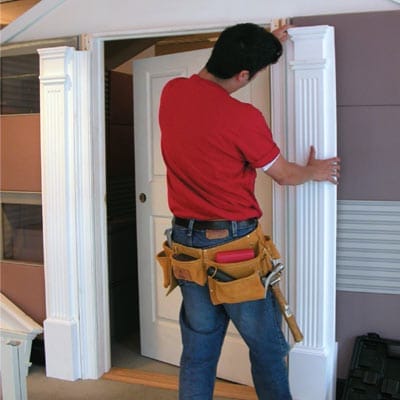 A man puts a column into place