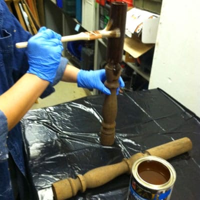applying coating the stair balusters