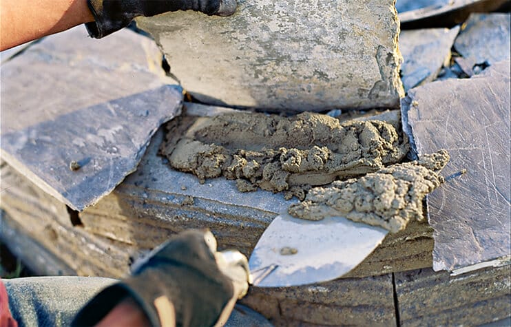 Capping the blocks of the fire pit
