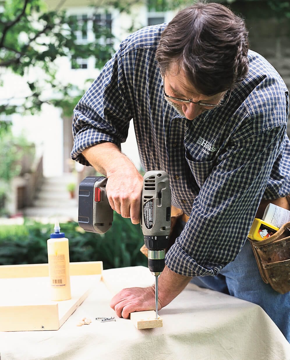 drilling the borders of the kitchen drawer and attaching them
