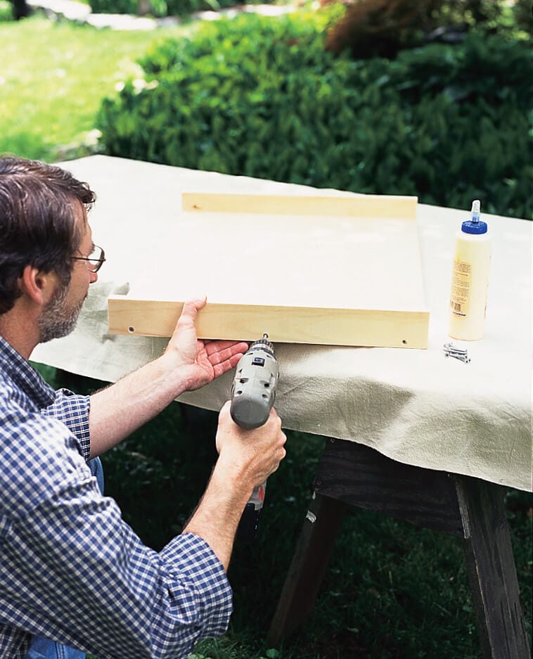 drilling the sides of the pull-out kitchen drawer to the base
