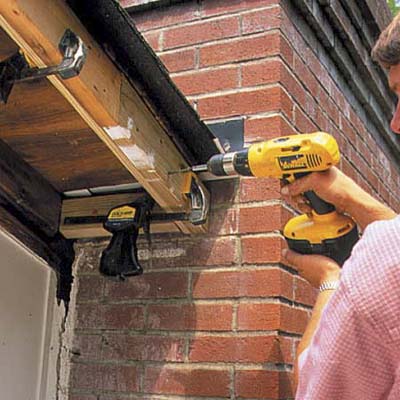 attaching a new rafter for fascia and soffit repair