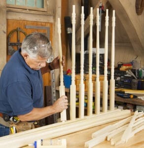 Tom Silva fitting pins into rail holes.
