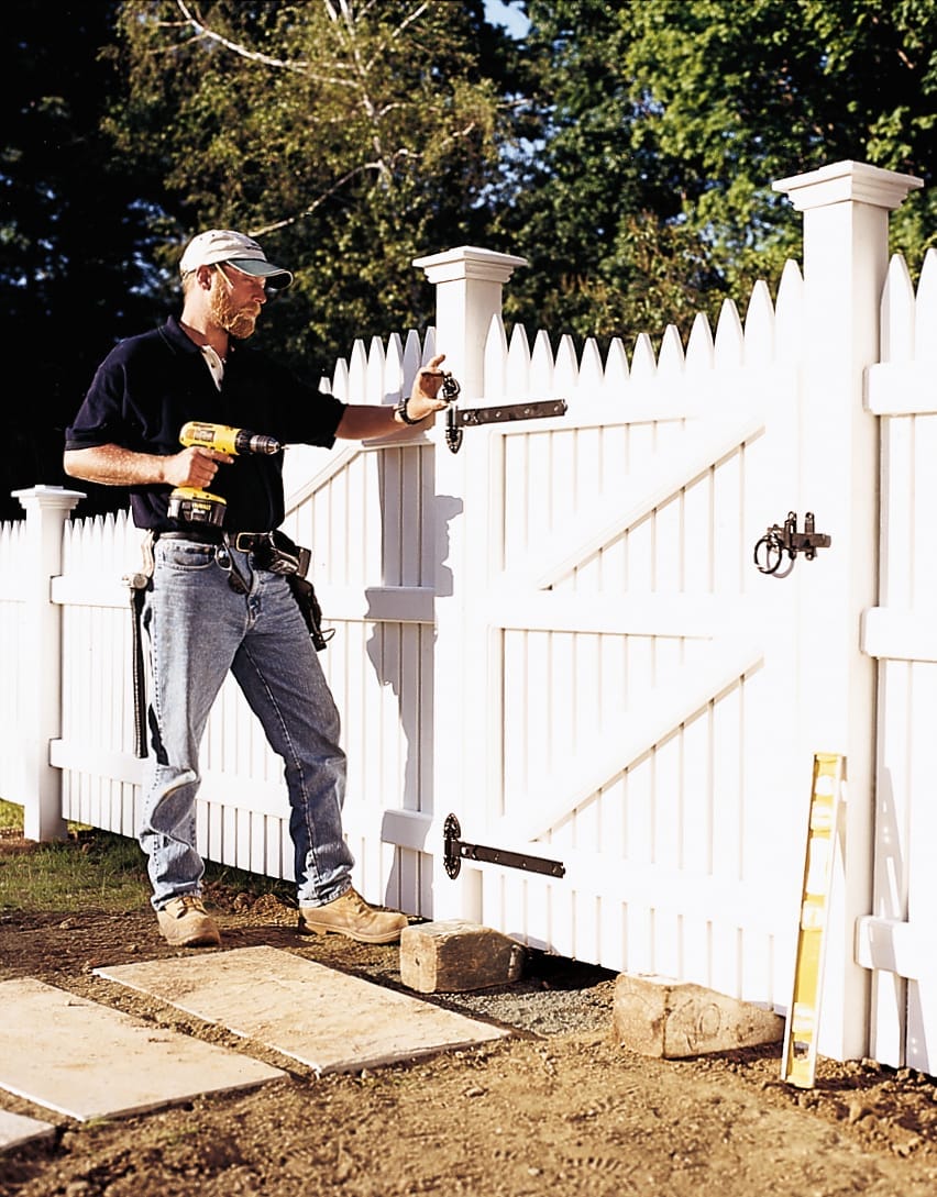 hanging the gate using a drill and brackets
