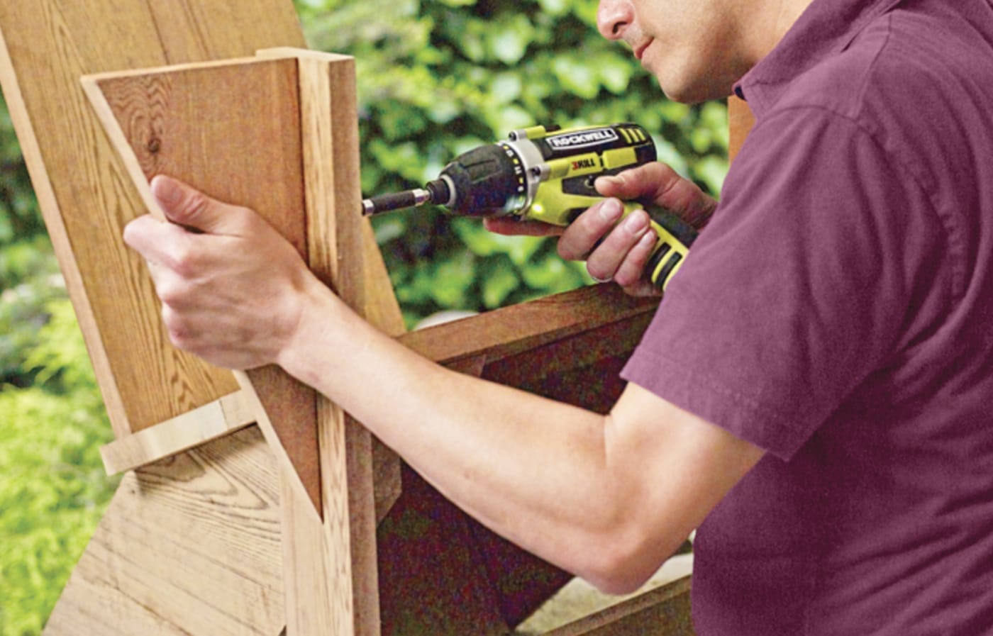Photo of a person mounting the arm brackets of a chair for a Westport chair building project. 