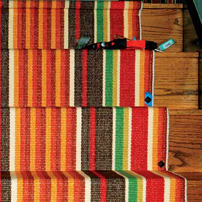 Striped runner on stairs.