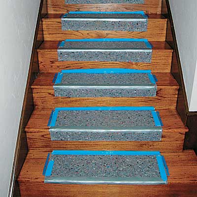 A well-managed stair runner installation work area.