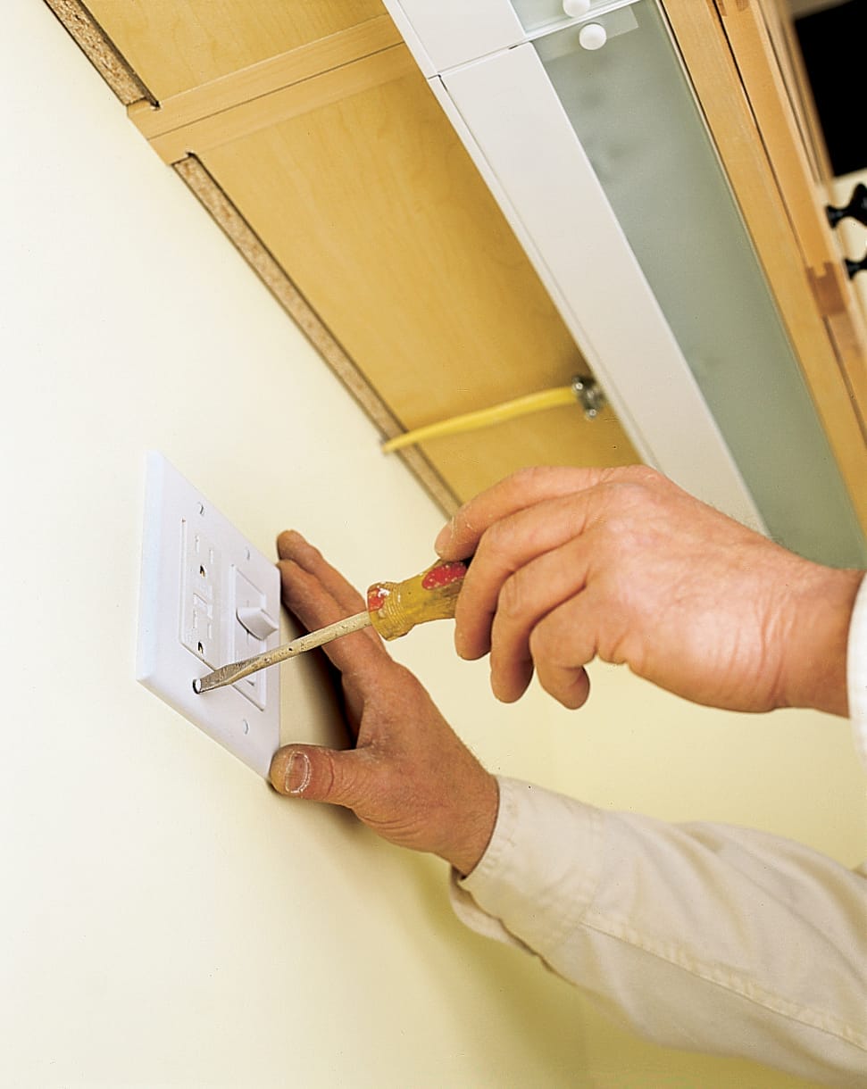 The light switch for undercabinet lights is screwed in.