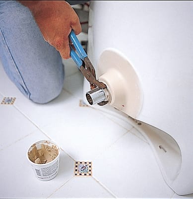 The basin of a pedestal sink is levelled.