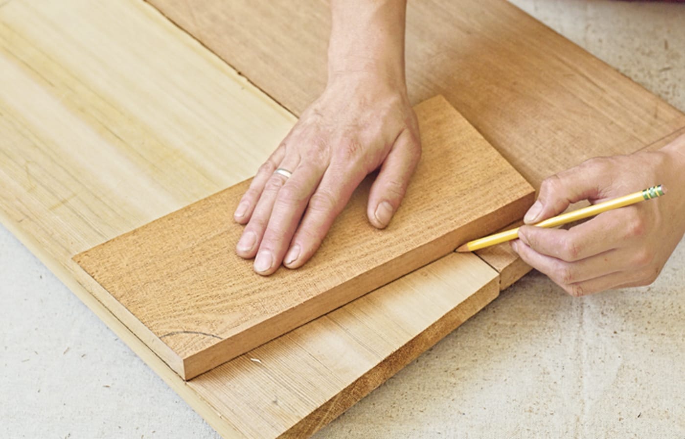 Photo of a person marking cutlines for the seat for a Westport chair building project. 