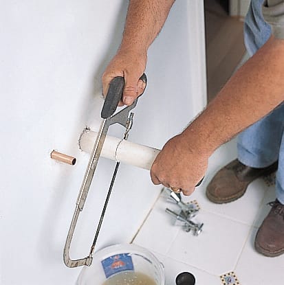 Rough-in plumbing is prepped for a pedestal sink.