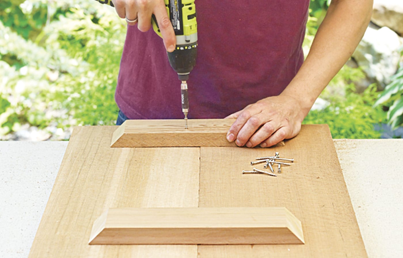Photo of a person attaching battens to wood for a Westport chair building project. 