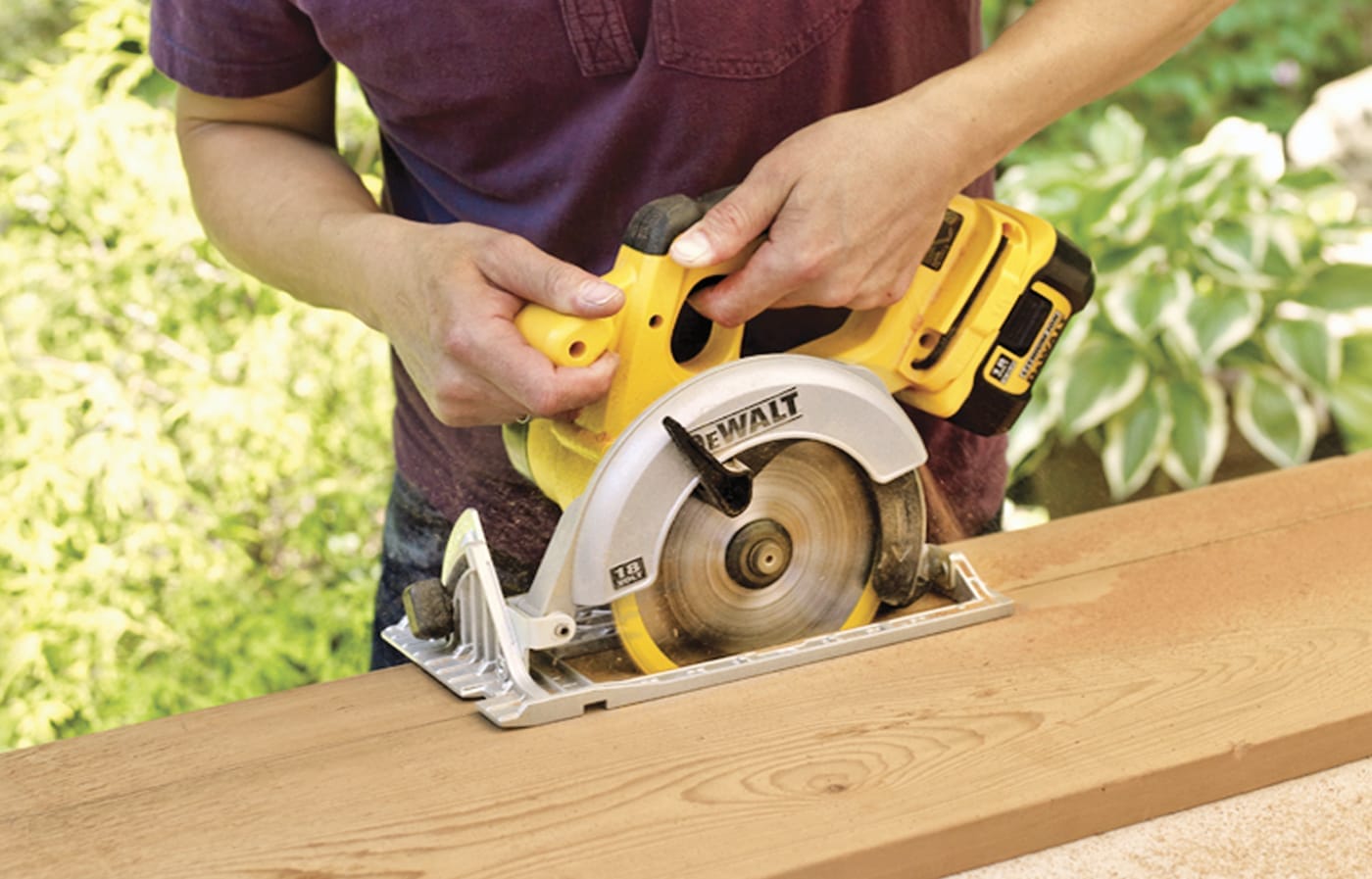 Photo of a person cutting the blank for the front legs of a Westport chair out of wood. 
