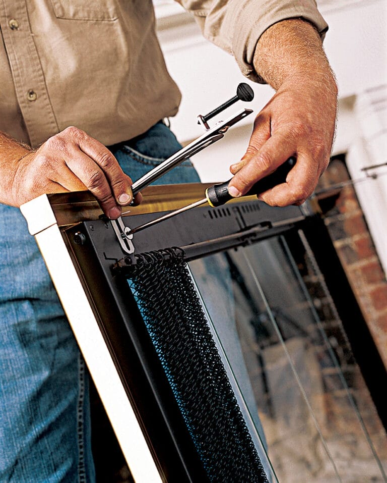 A man attaches Lintel Clamps to the Door.