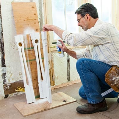 Man priming the balusters