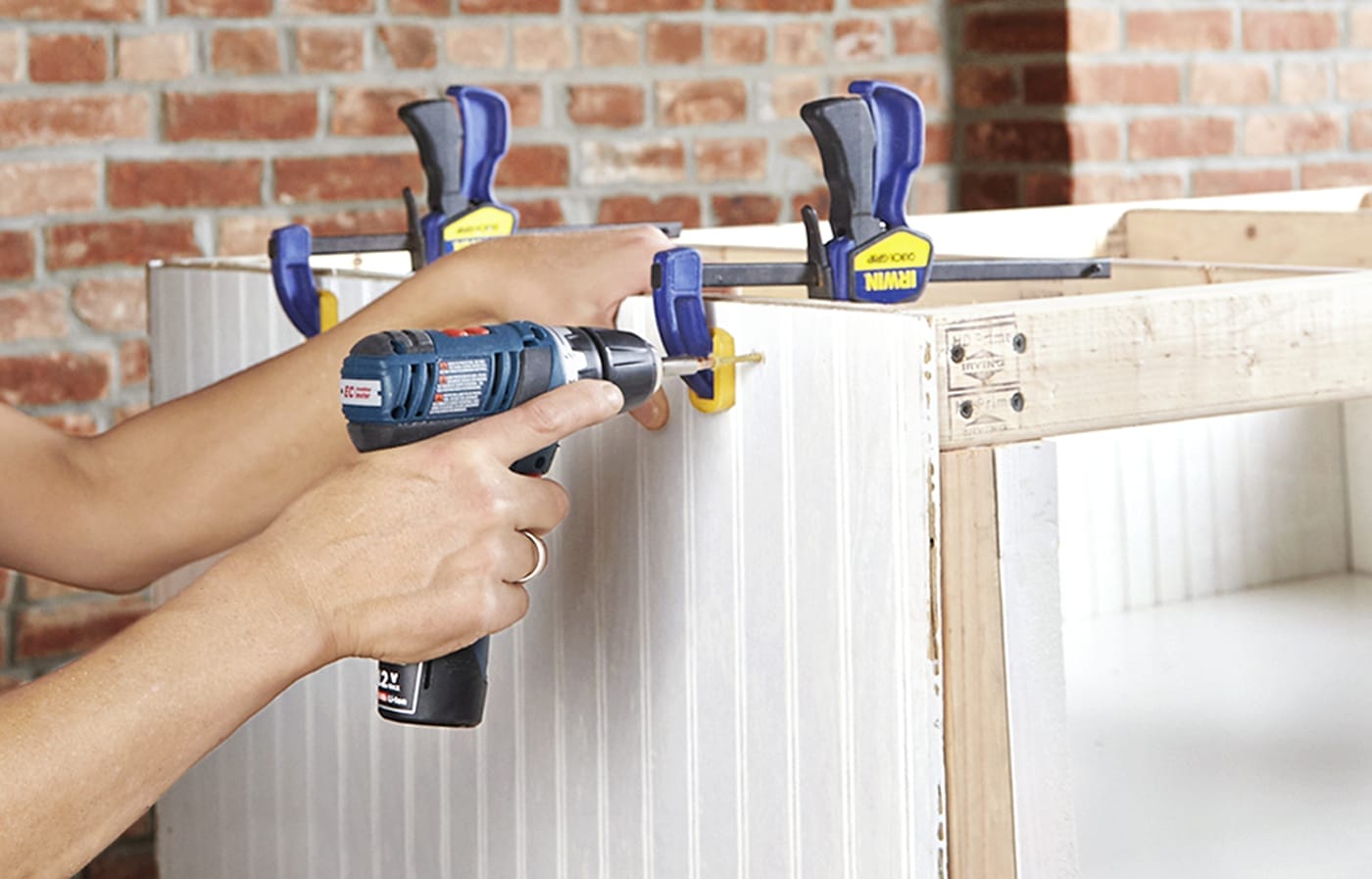 screwing in the beadboard to the base of the laundry pedestal
