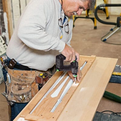 Man drilling pilot holes