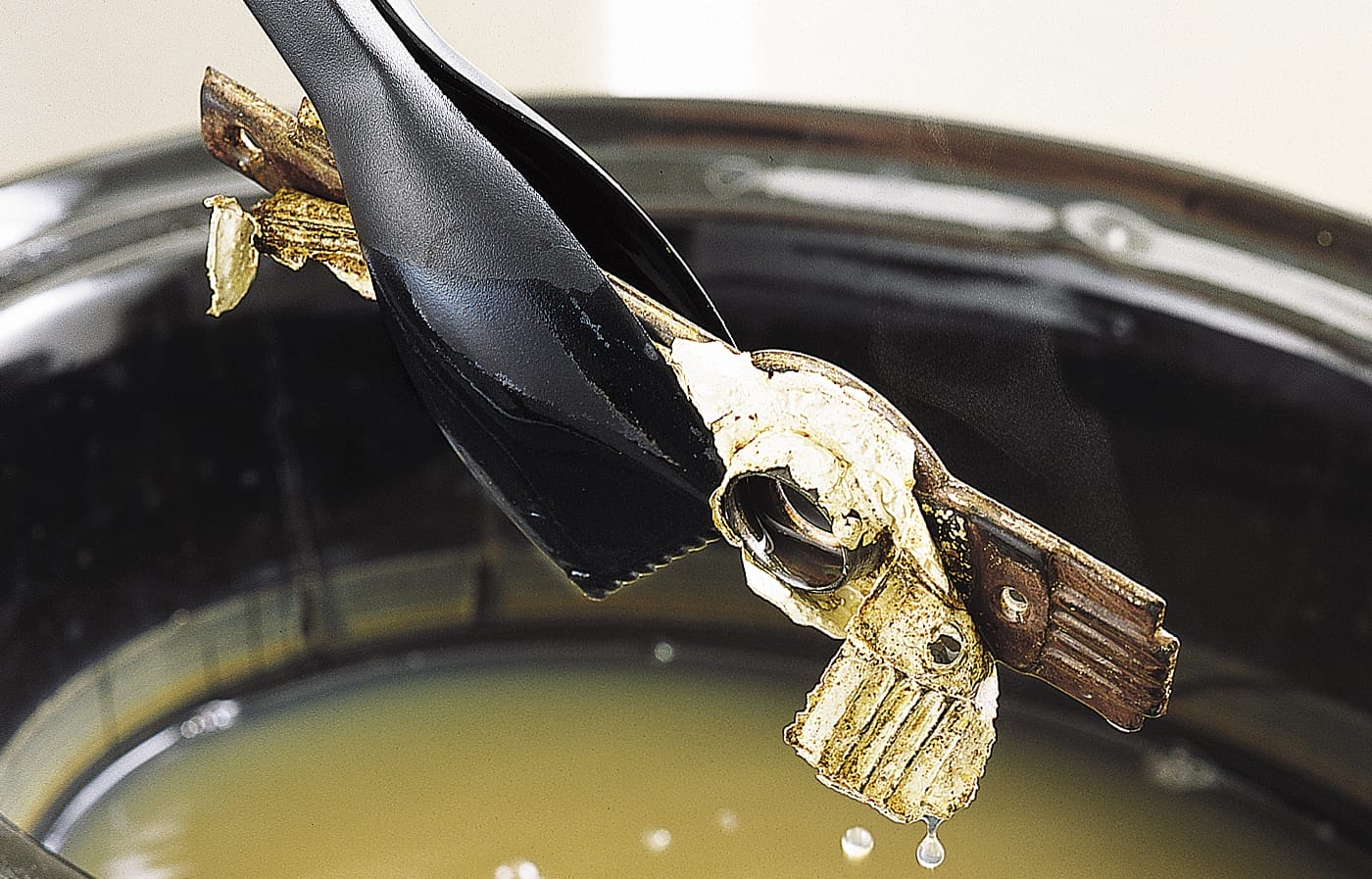 Crockpot method of removing paint from hardware