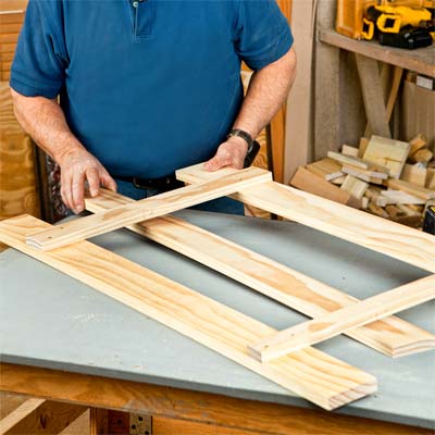 A person gluing on a lower cleat.