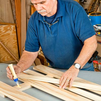 A person gluing the casings to the cleats.