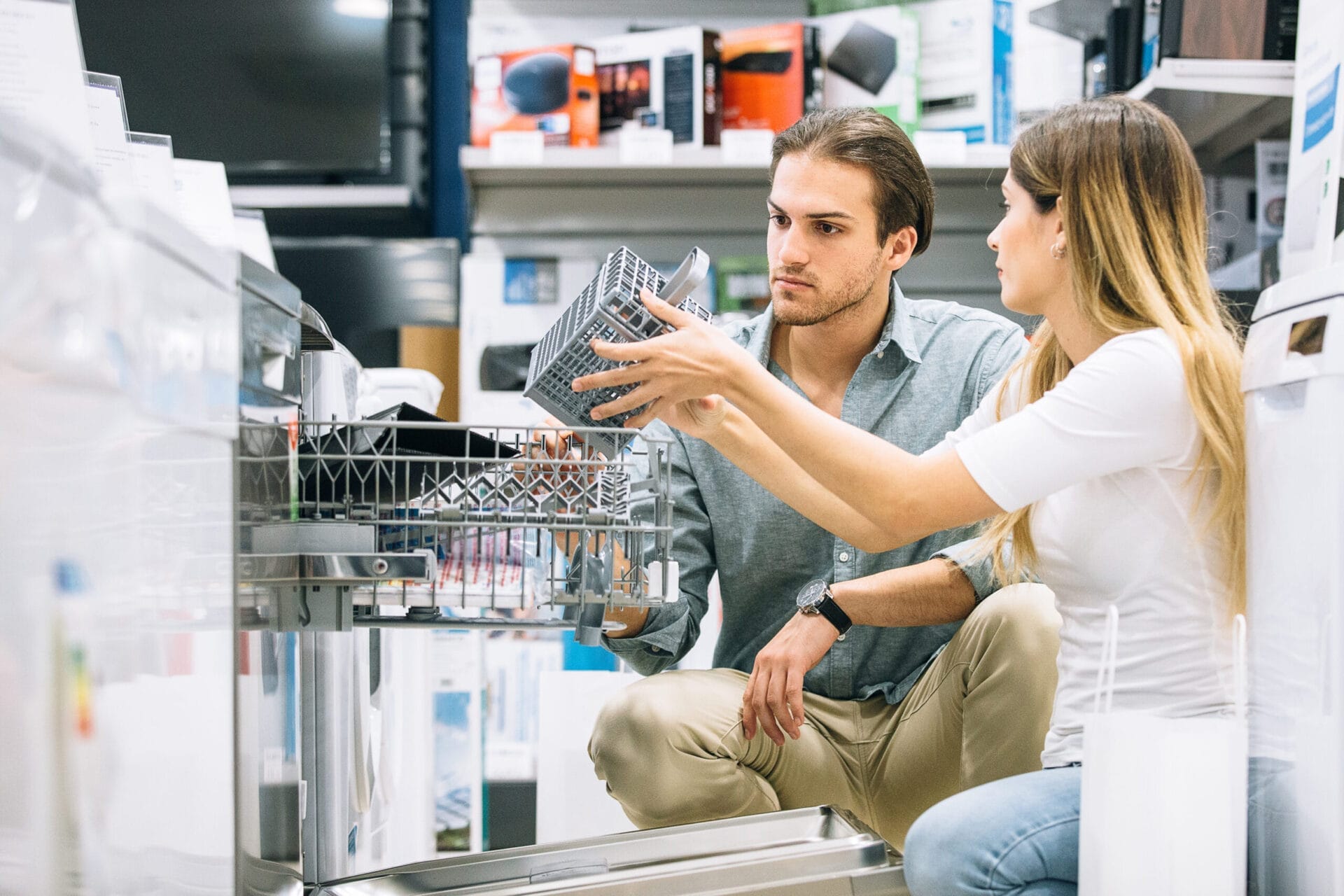 A couple in a store selecting products for a kitchen redesign