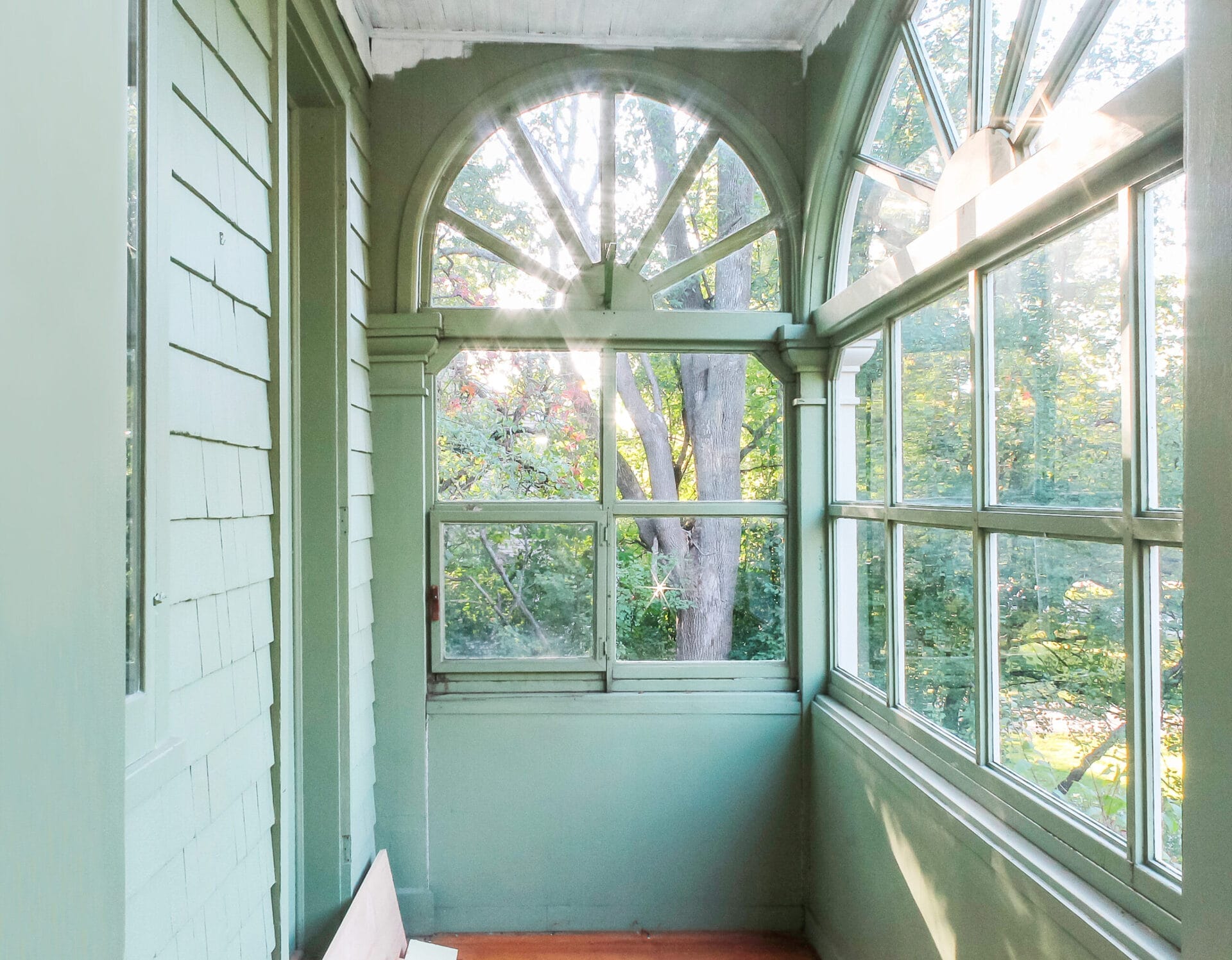 A before photo of a green porch