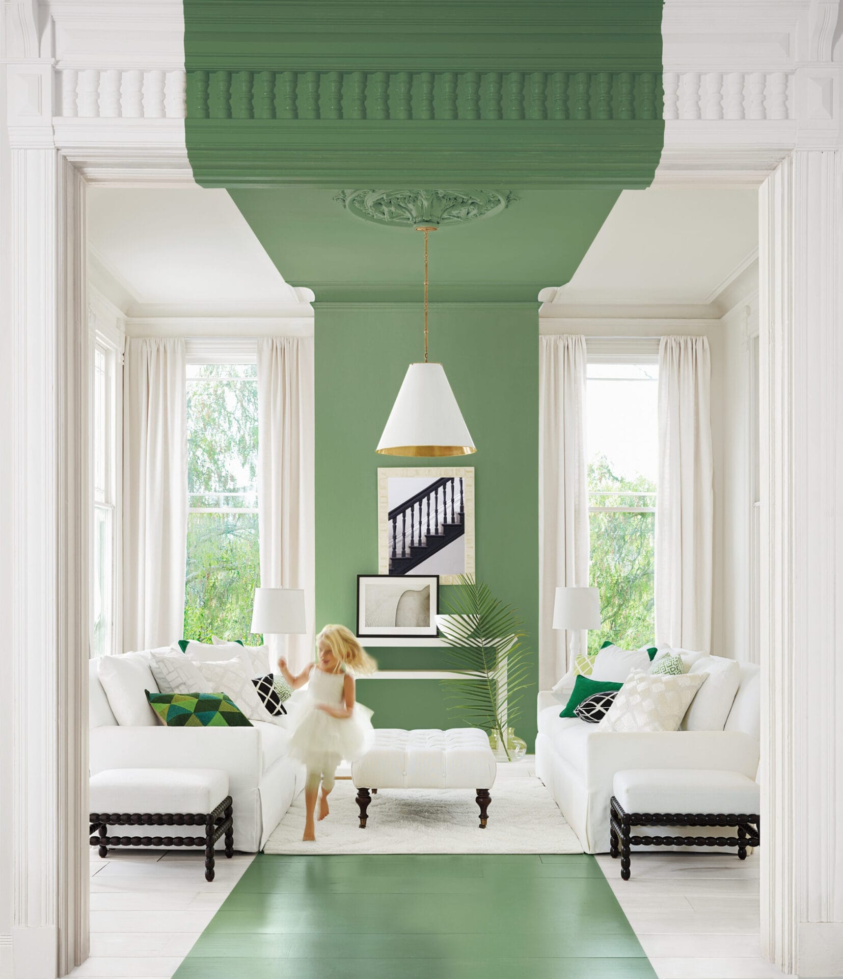 Room with large wide green paint stripe on white walls.