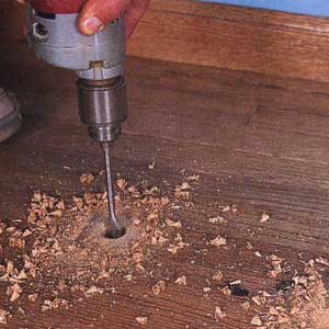 An image of the subfloor being cleaned and prepped.