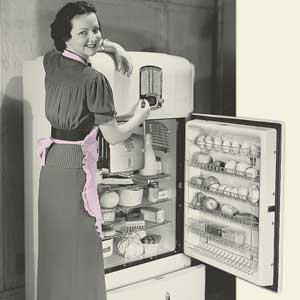 A woman standing with an open refrigerator