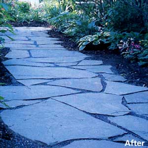 After photo of a stone path through a garden made up of large stones.