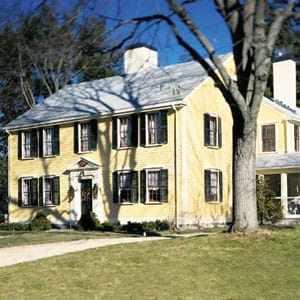 Two-story yellow house.