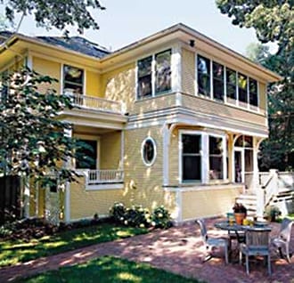A two-story yellow house