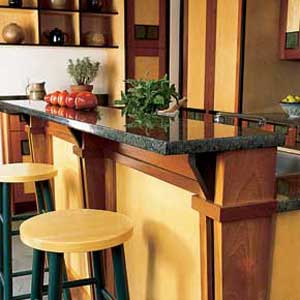 Two stools in front of a kitchen bar counter.