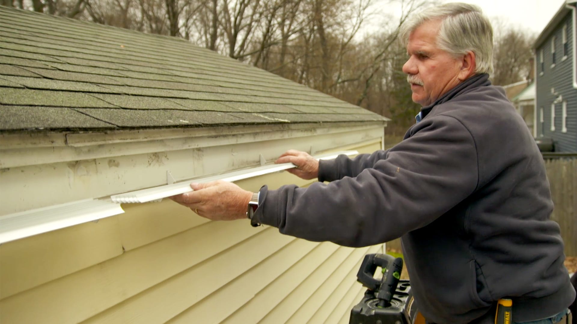 Tom Silva installing a gutter alternative.