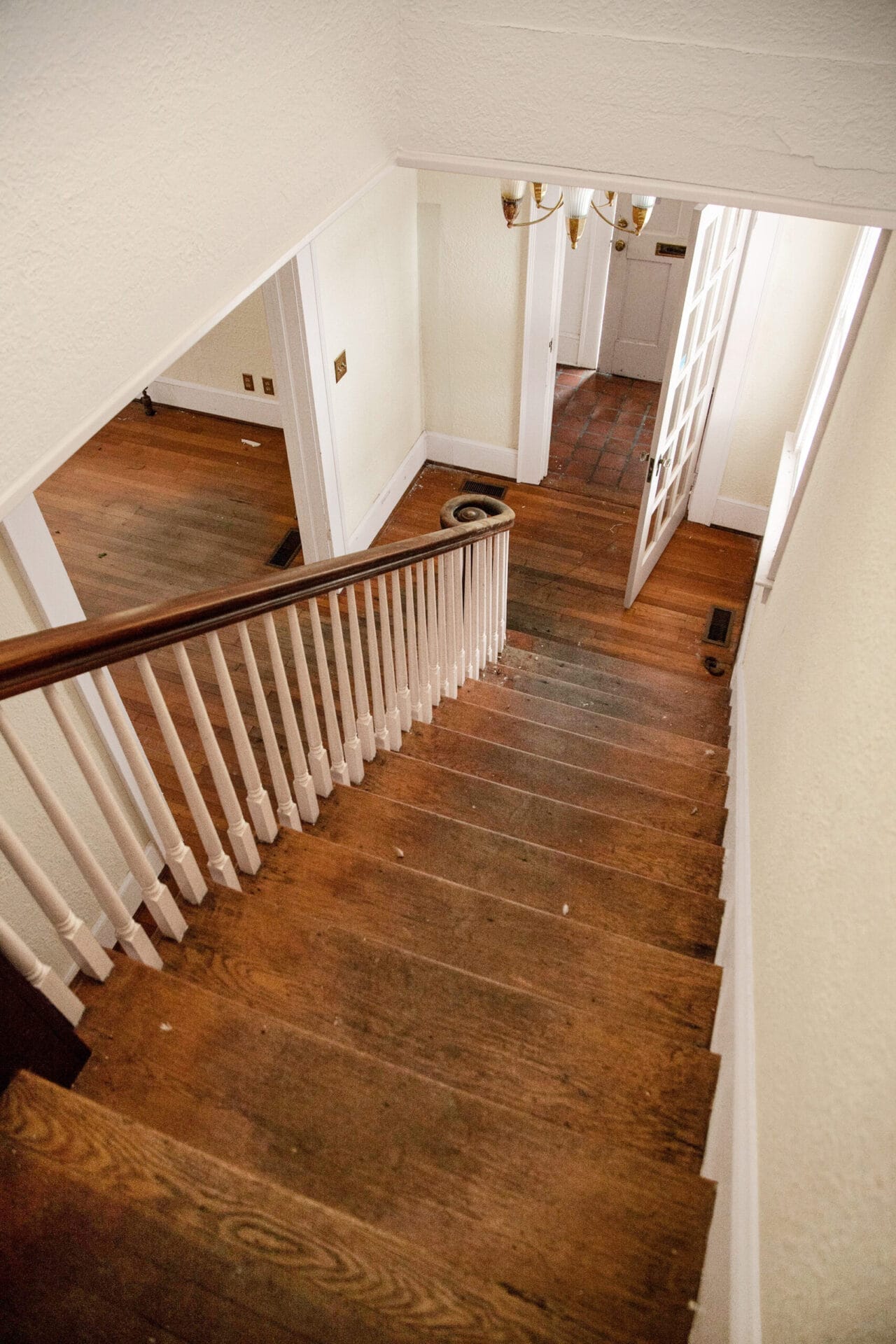 A view of the stairs from above, showing some wear and tear.