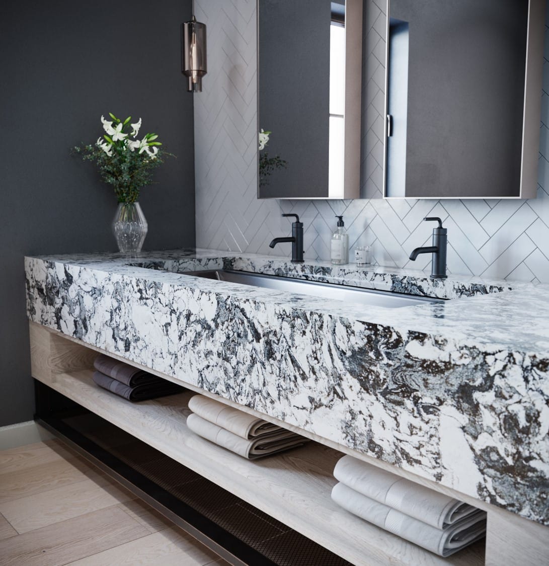 A large bathroom sink with double faucets.