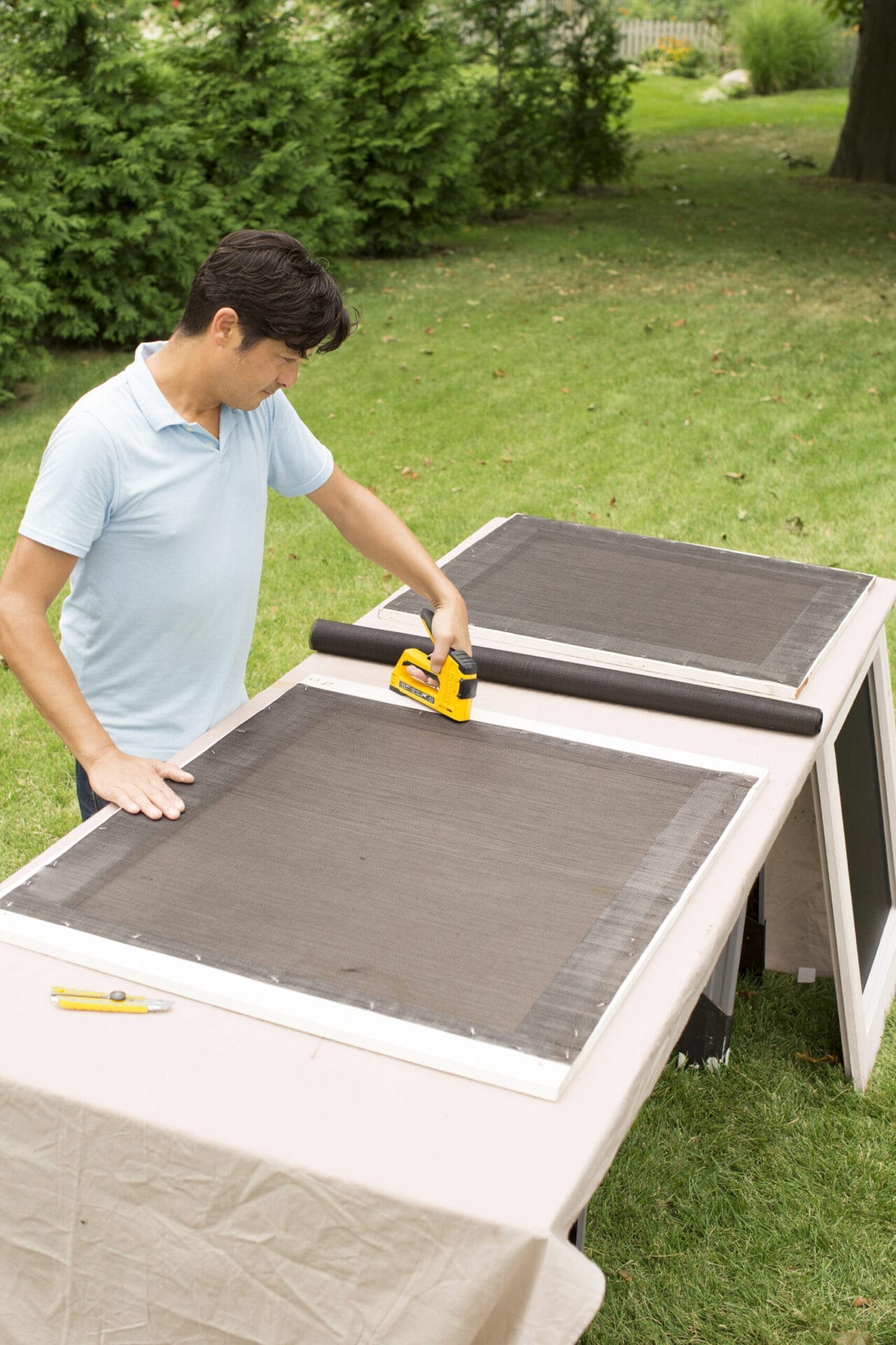 nailing in a new screen for the screen of the sliding door