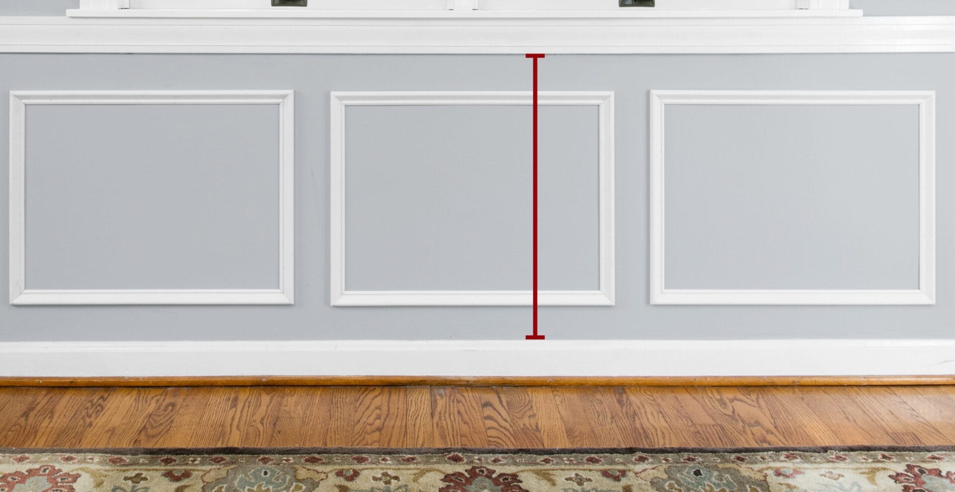 Finding the distance between the baseboard and chair-rail molding.