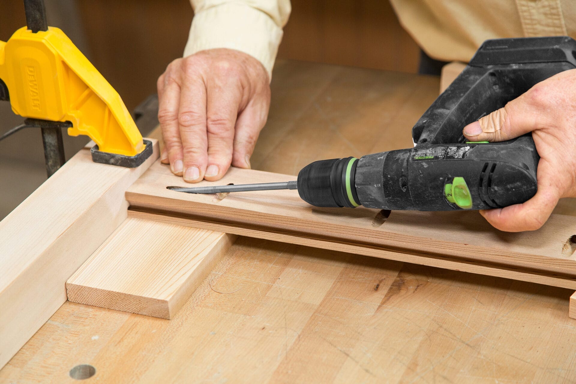 The top rails of the cedar planter box are attached by drilling through the pocket holes.