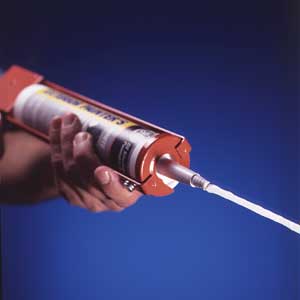 A caulk gun being used to lay a perfect bead of caulk.