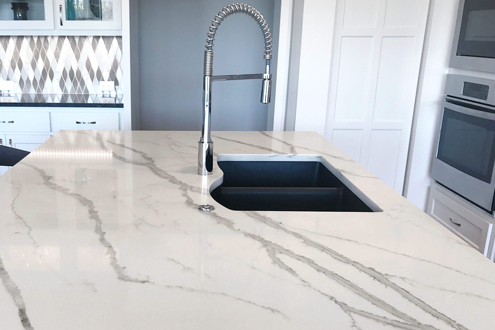 A painted faux marble countertop in a kitchen.