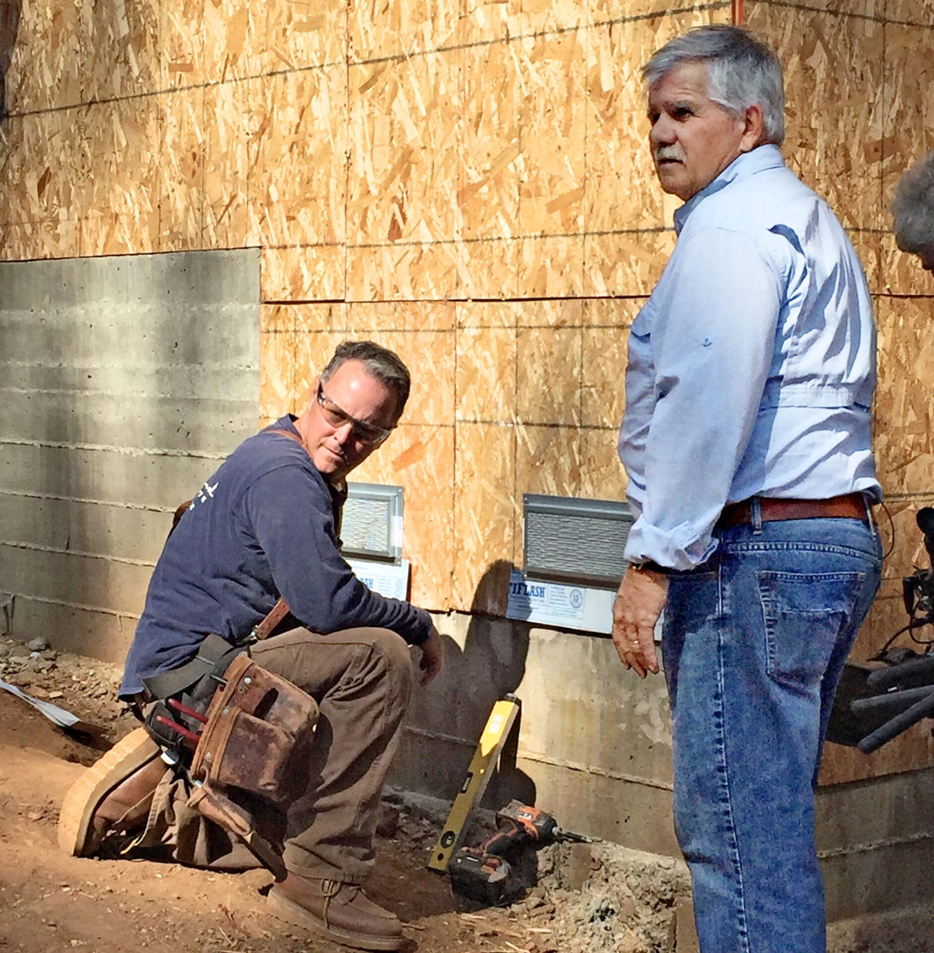 This Old House crew members working on a house.