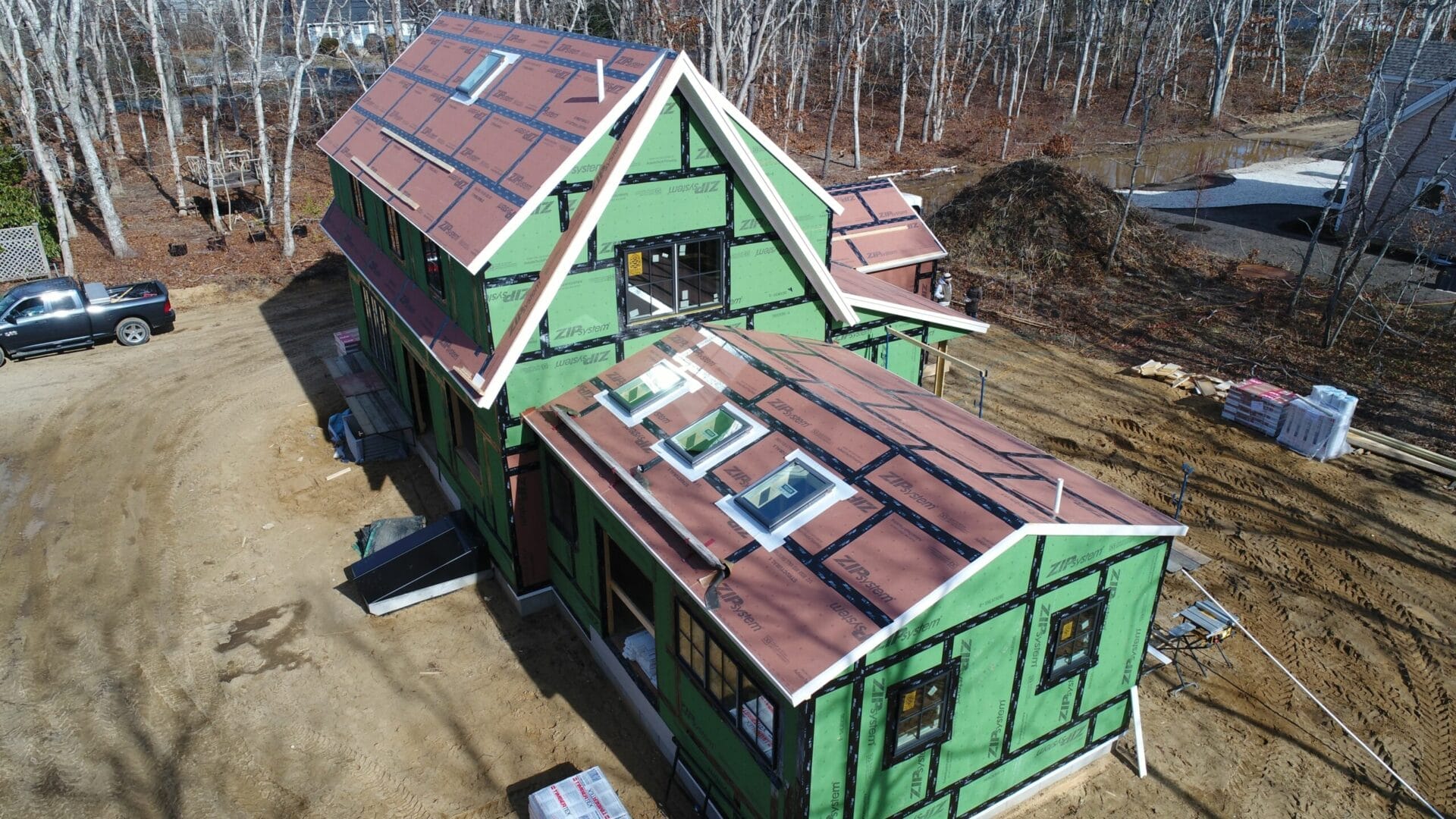 The house with sheathing attached and skylights installed.