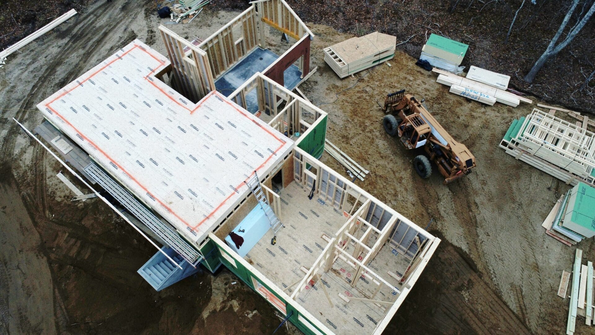 An aerial view of a house in the construction process.