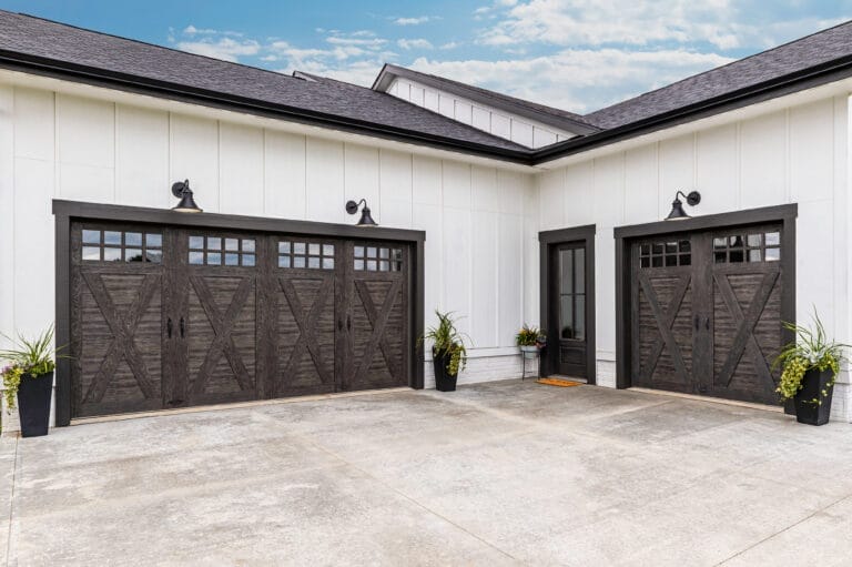 Two mixed medium faux wood garage doors.