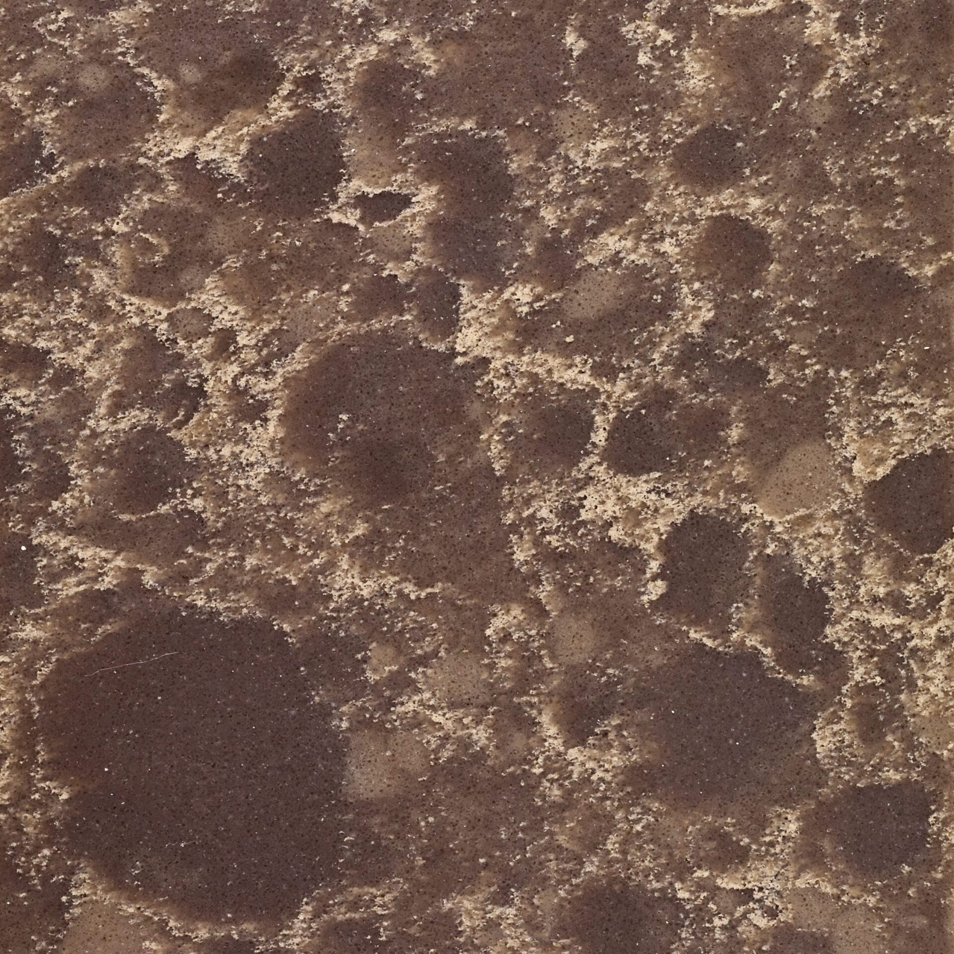 Brown quartz displaying tan watermark speckles and natural stone appearance.