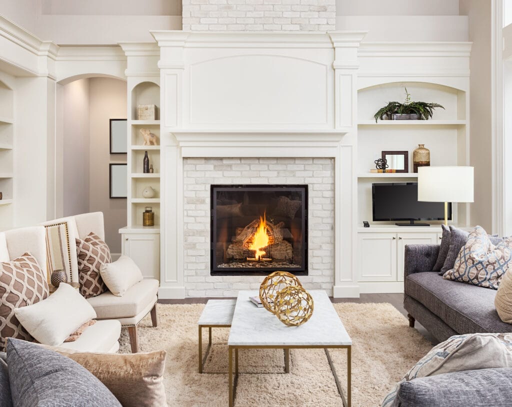 A fireplace mantel that is ready to be decorated.