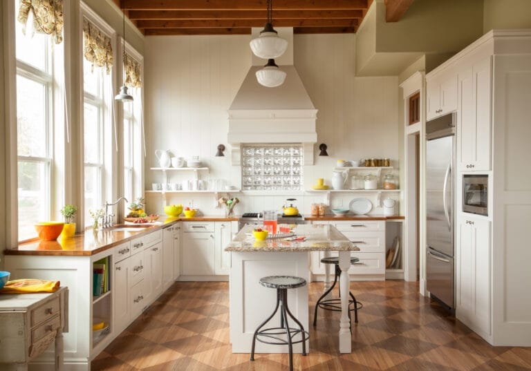 Bright remodeled kitchen with tall ceilings and wood countertops.