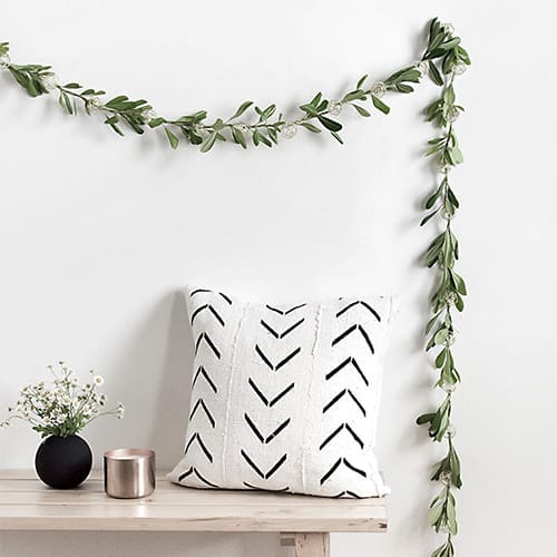 String lighting with leaves attached to give it a natural look.