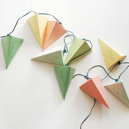 Lighting in the shape of pyramids hanging from a string.
